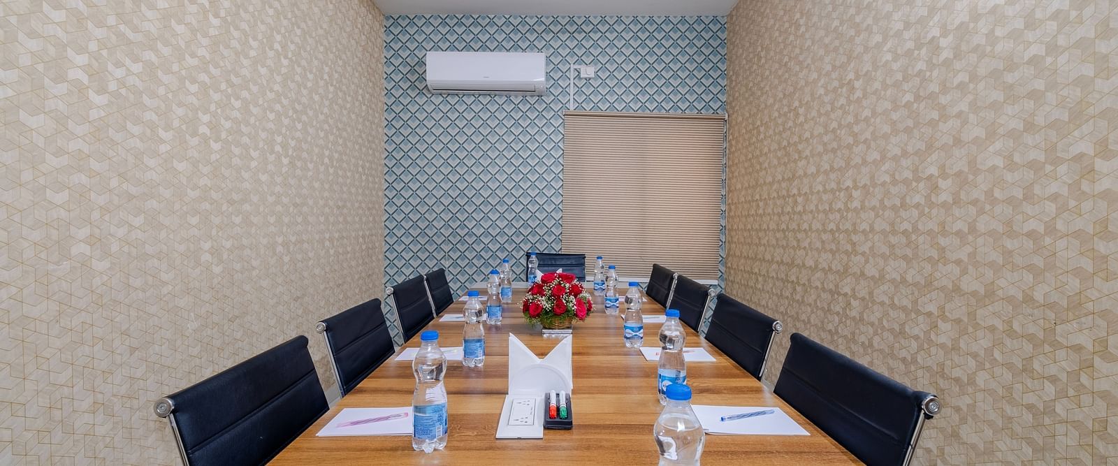 Boardroom setup with table and seating at Lemonridge Hotels
