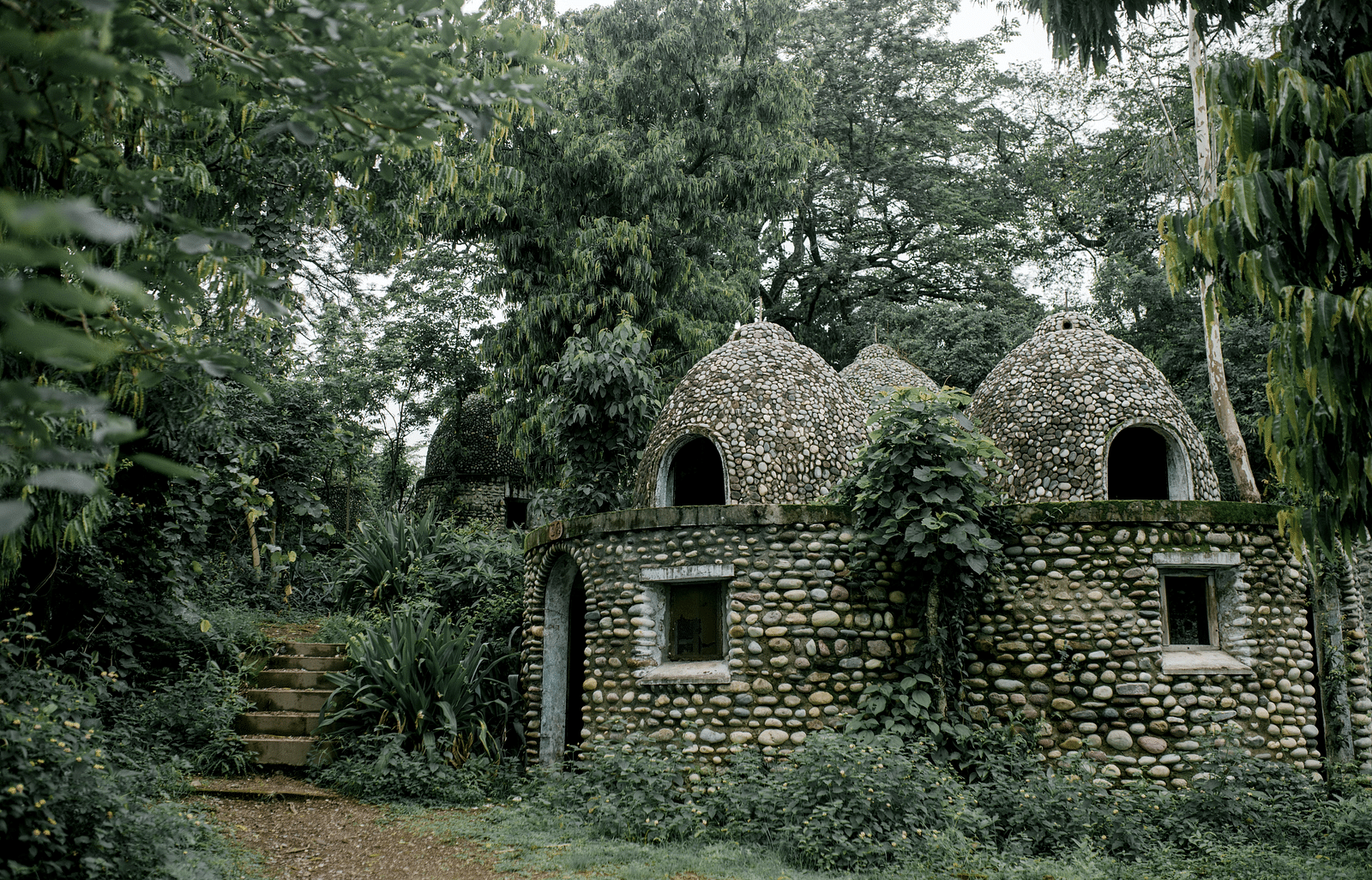A temple surrounded by trees and bushes