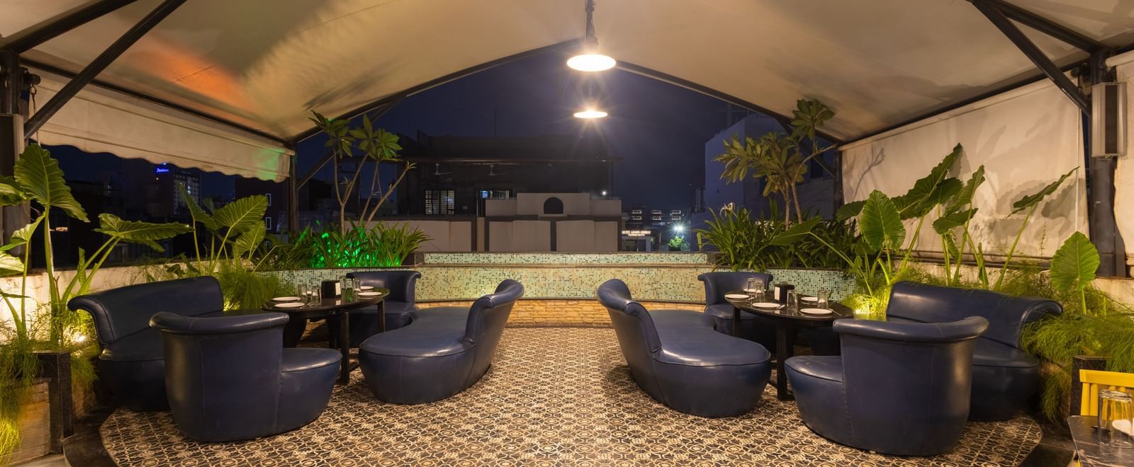 Rooftop dining setup in the Pravasa Cafe at Pravasa Stay Vijay Nagar, Indore.