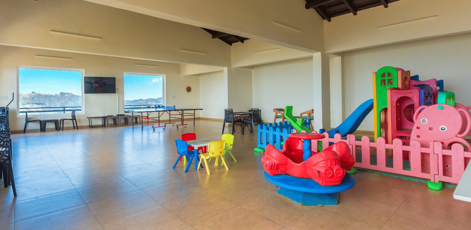 A dedicated and safe indoor play space for children with colourful toys at Himalayas Resort By The Lake Hill, Mukteshwar.
