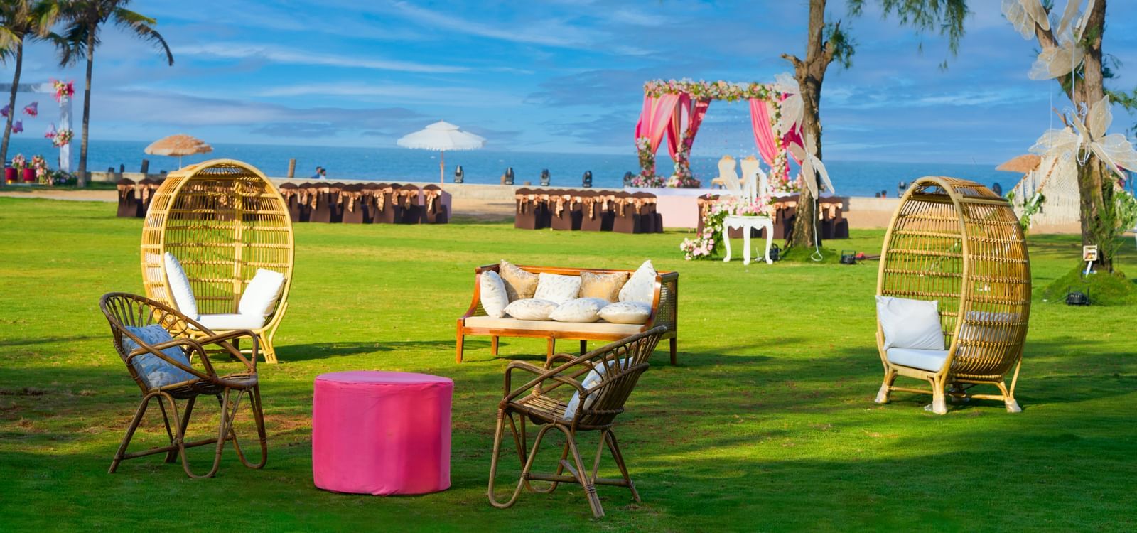 Outdoor lawn area decorated for an event with seating spaces under the blue sky at Grande Bay Resort  & Spa.
