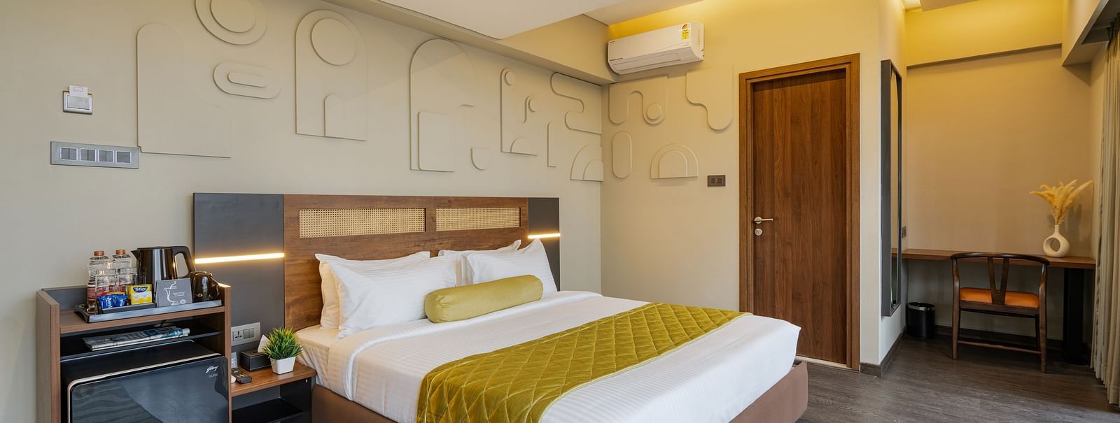 Citrus Room at Fressotel, Kanakapura Road, with a 240 sq. ft. space, air-conditioning, and a 40-inch Android TV.