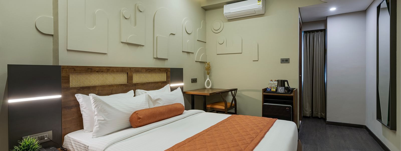 Elegant Tangerine Room offering modern amenities in a tranquil setting at Fressotel, Kanakapura Road.