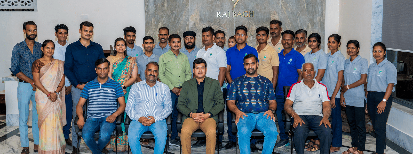 An overview of the wellness team at Rajbagh Wellness posing for a picture together.