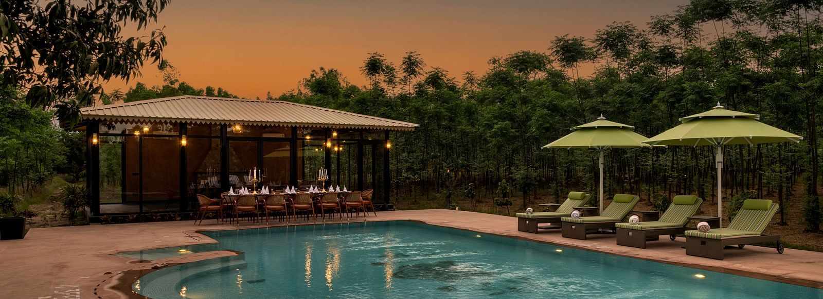 A huge swimming pool surrounded by sun loungers - Aalia Jungle Resort & Spa