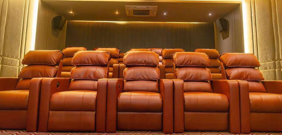 A theatre setup with recliner sofas at Montclair Ananta, Elite.