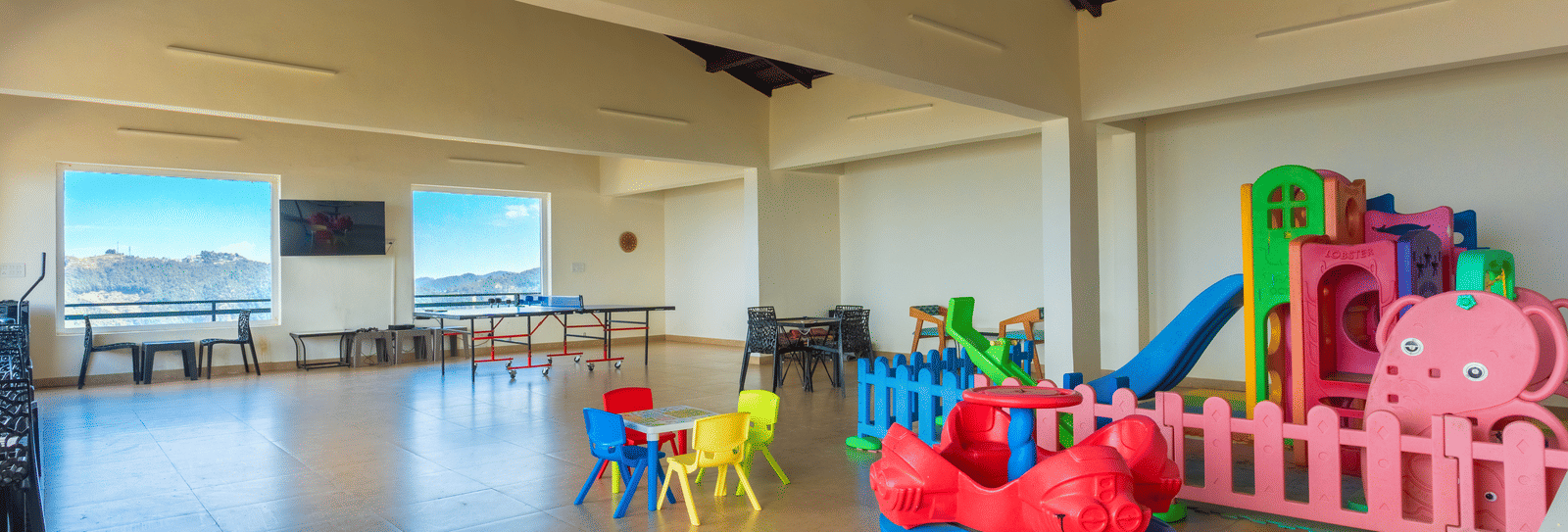 A dedicated and safe indoor play space for children with colourful toys at Himalayas Resort By The Lake Hill, Mukteshwar.
