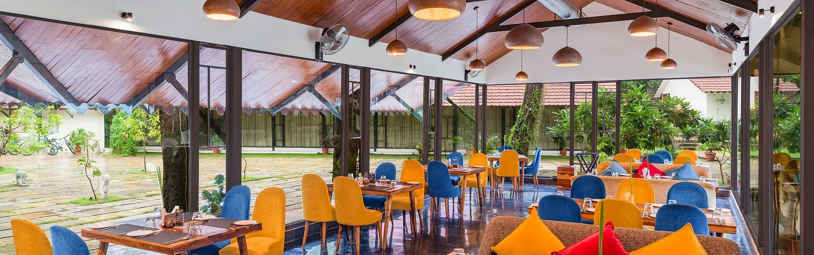 image featuring the full view of Kalptaru with nicely arranged chairs and tables for a multi-cuisne dining experience at aranya vilas in udaipur 