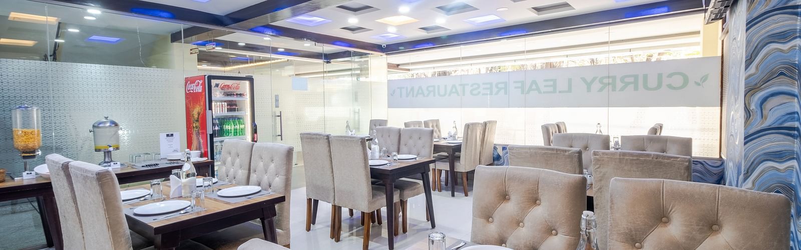 Dining tables arranged in the restaurant at Lemonridge Hotels
