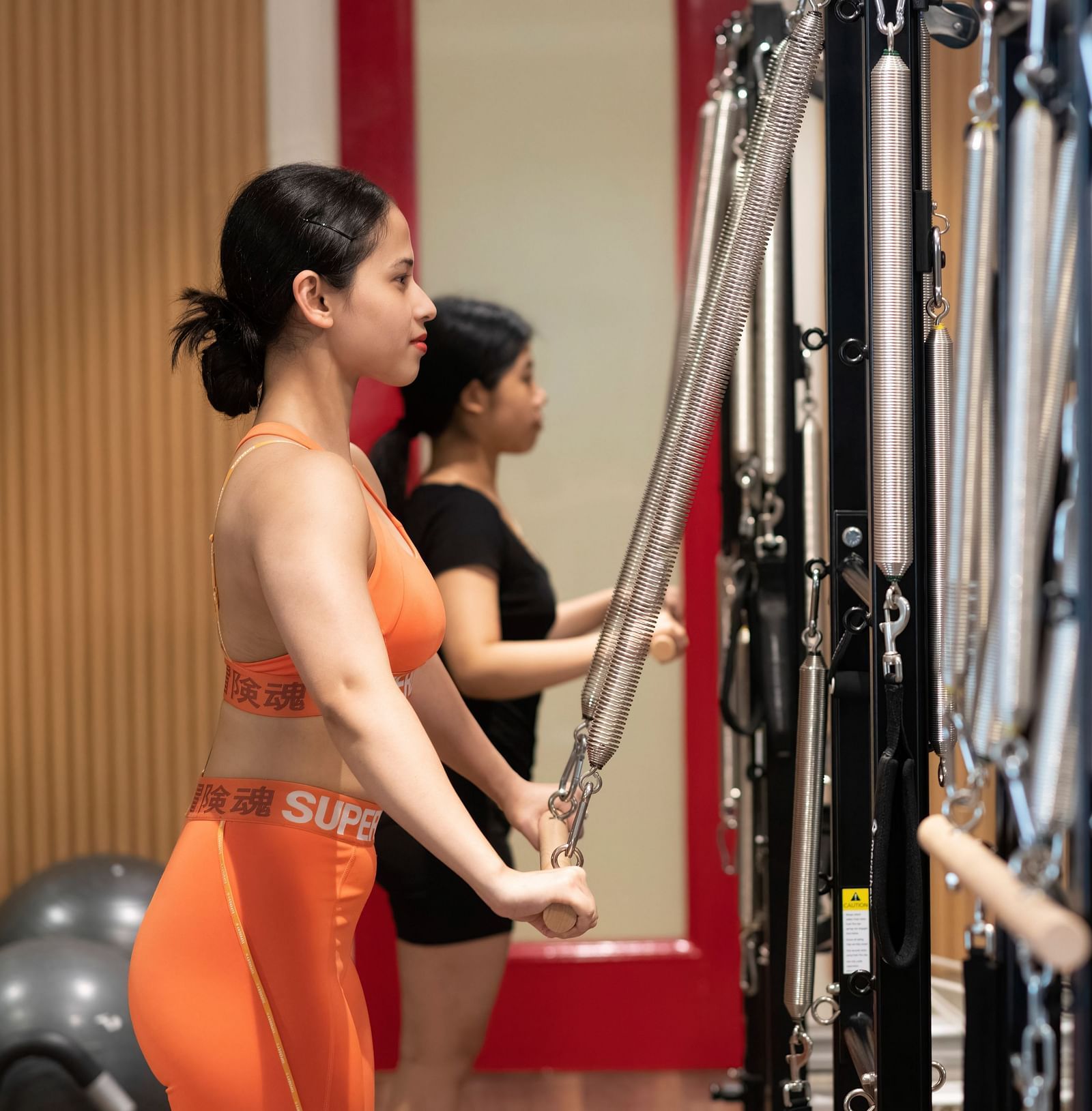 image of two women performing Pilates at the sumaya - The Claridges New Delhi 