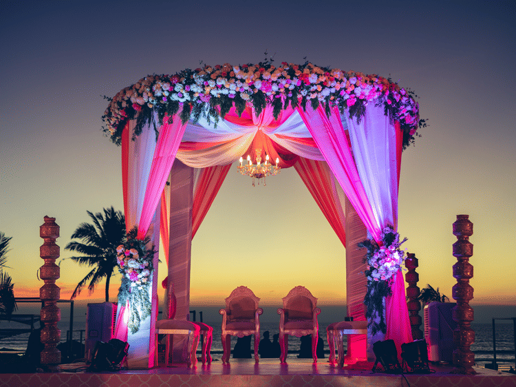 View of Palm Lawn with lights on during sunset for finest wedding venues in south goa