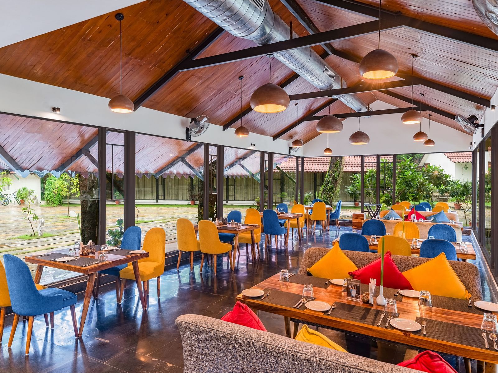 image featuring the full view of Kalptaru with nicely arranged chairs and tables for a multi-cuisne dining experience at aranya vilas in udaipur 