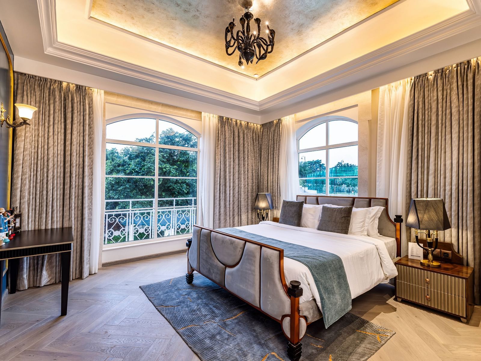 Full view shot of the bedroom of the Suite with ample natural light coming from the windows at Imperial Goa.