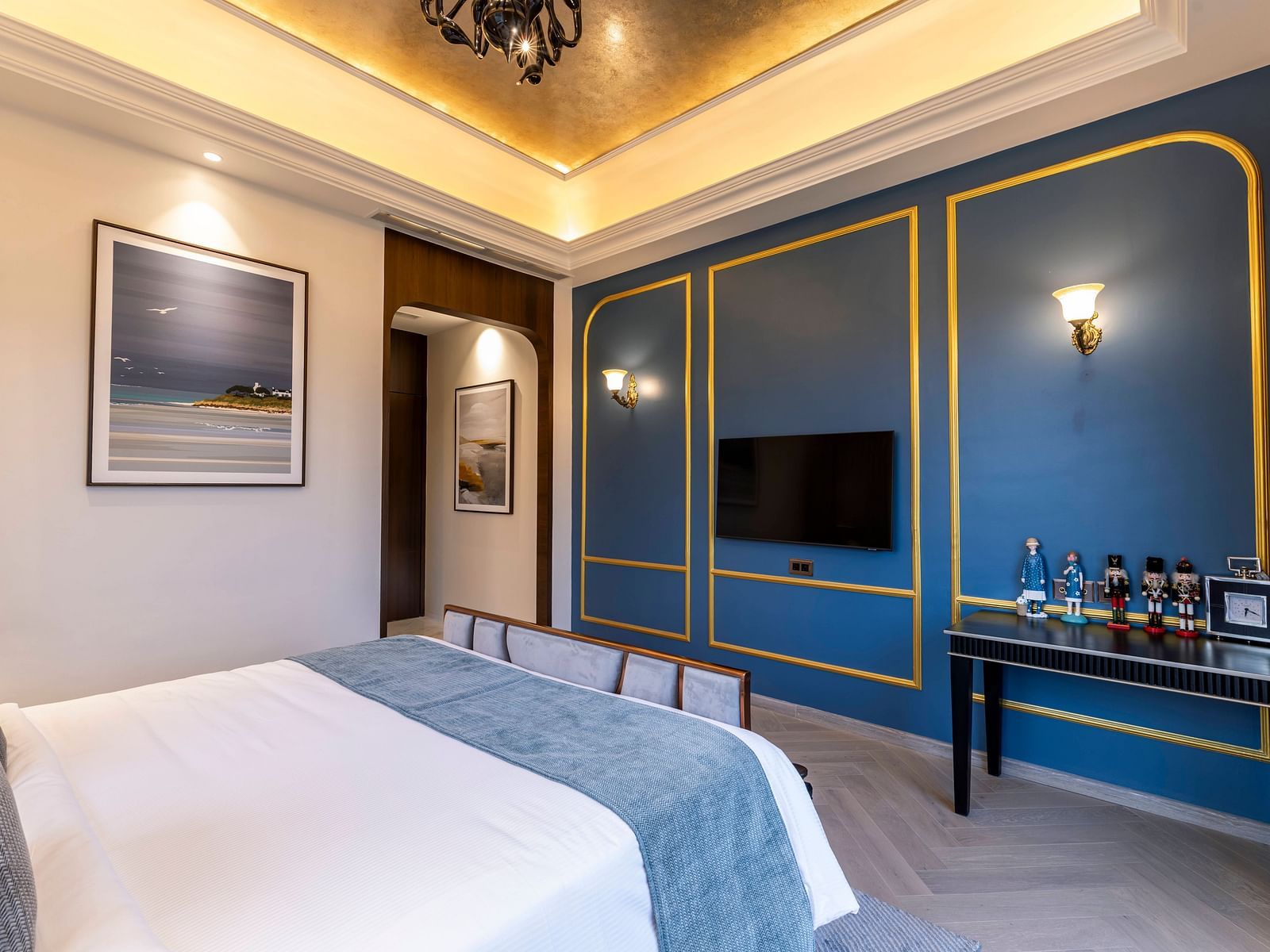 Corner view angle of the bedroom of the Suite with a double bed along with a false ceiling above it at Imperial Goa.