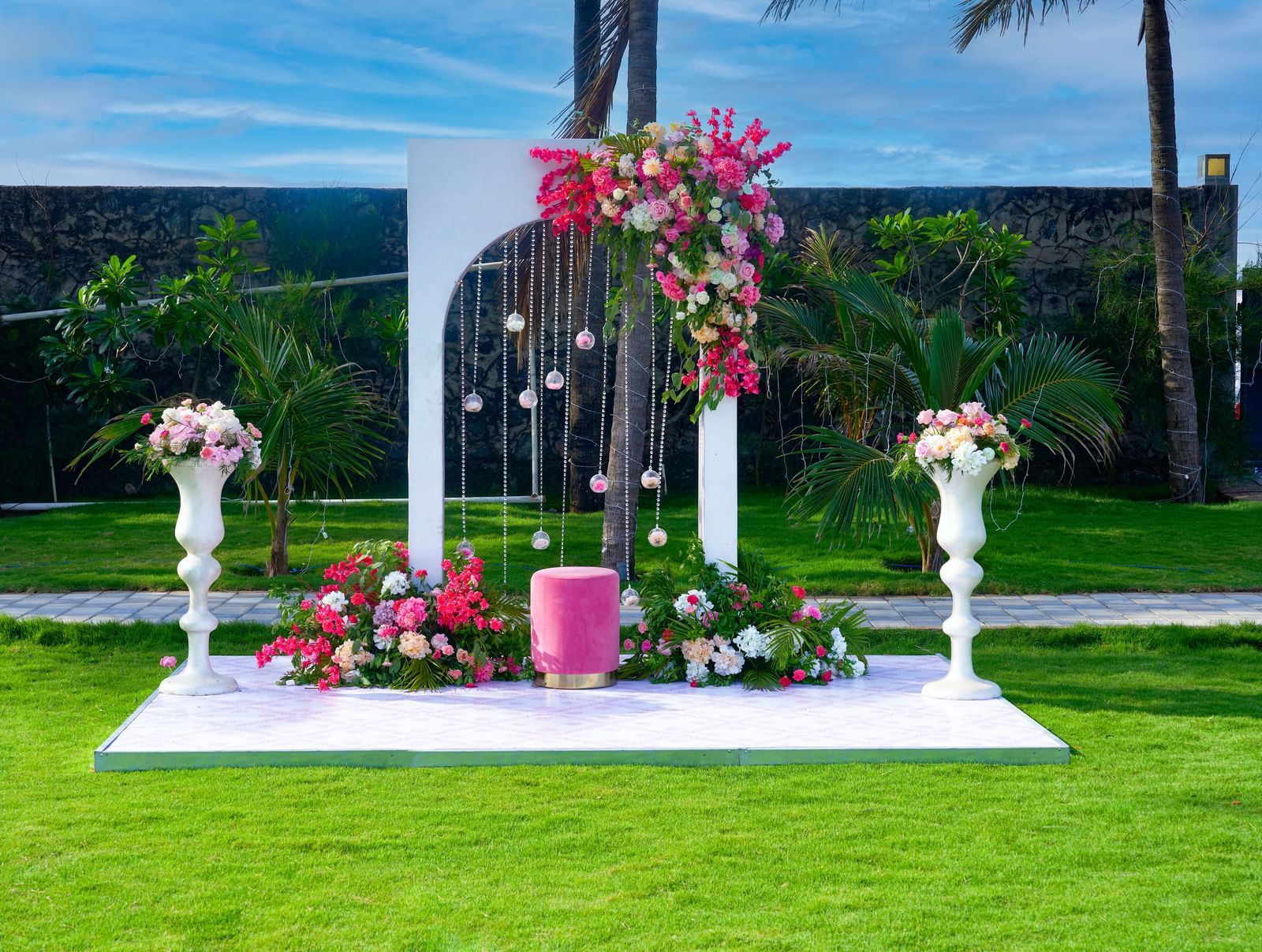 A decorated space with flowers & lights at the lawn at Grande Bay Resort & Spa.