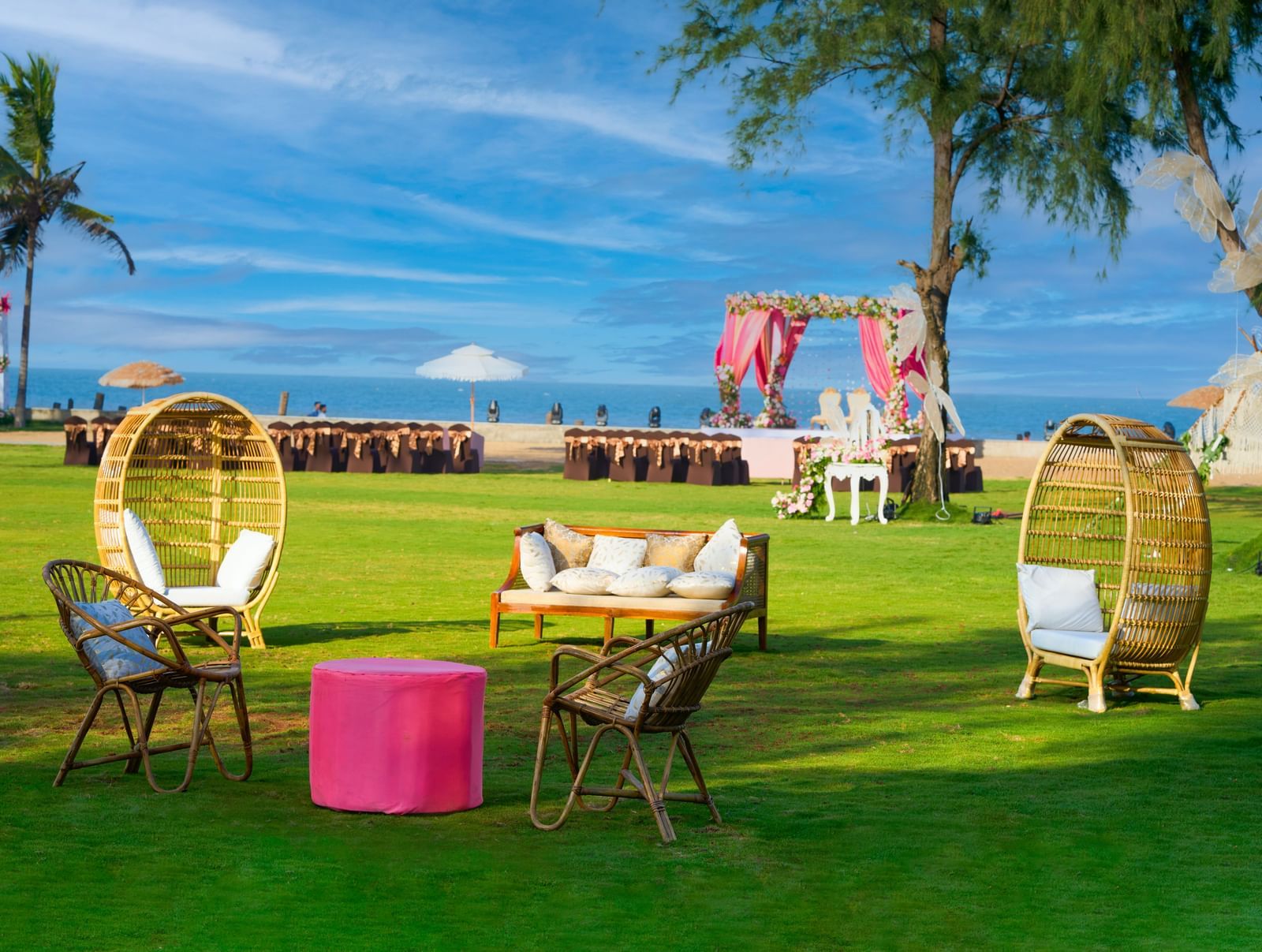 Outdoor lawn area decorated for an event with seating spaces under the blue sky at Grande Bay Resort  & Spa.