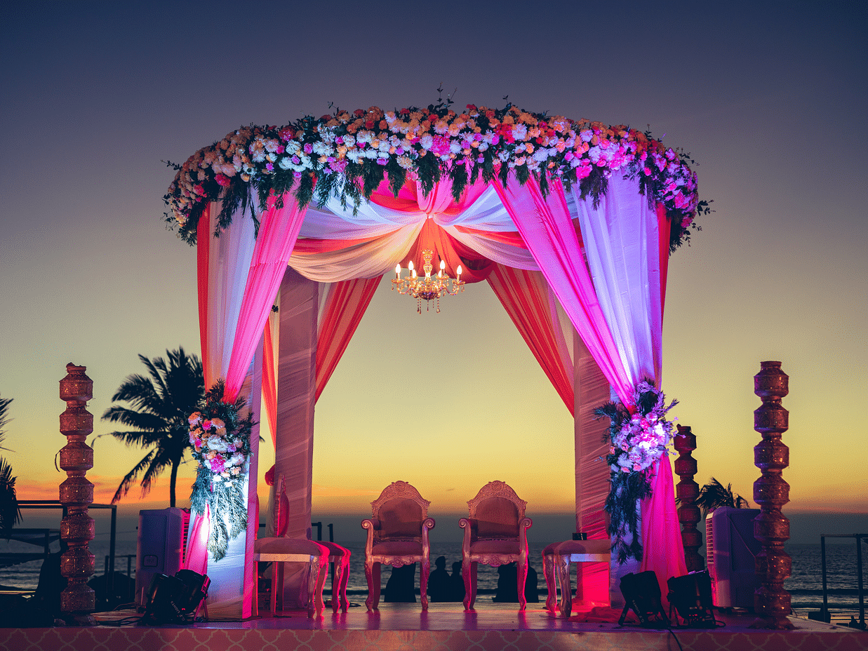 View of Palm Lawn with lights on during sunset for finest wedding venues in south goa