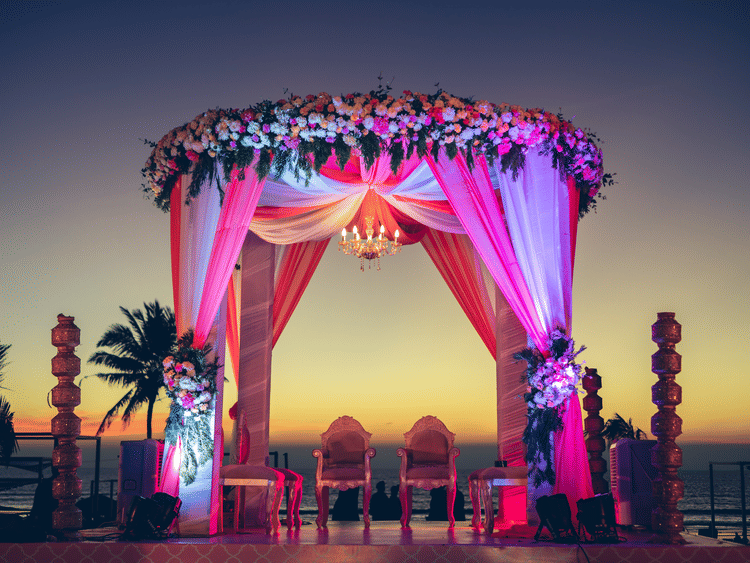 View of Palm Lawn with lights on during sunset for finest wedding venues in south goa
