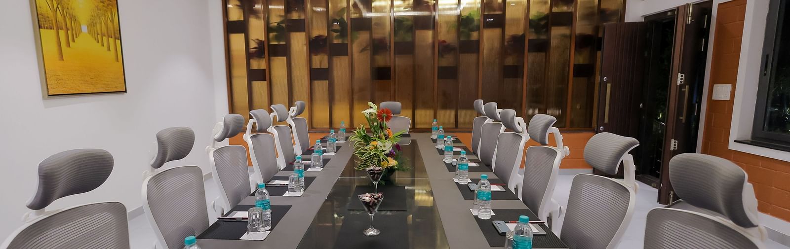 Modern boardroom at Trishvam Symphony, Krishnagiri, set with executive chairs, water bottles, and a professional meeting setup.