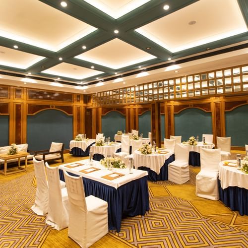 State Room - Sophisticated banquet hall with decorative ceiling, patterned carpet, and round tables for events -  Polo Floatel Kolkata