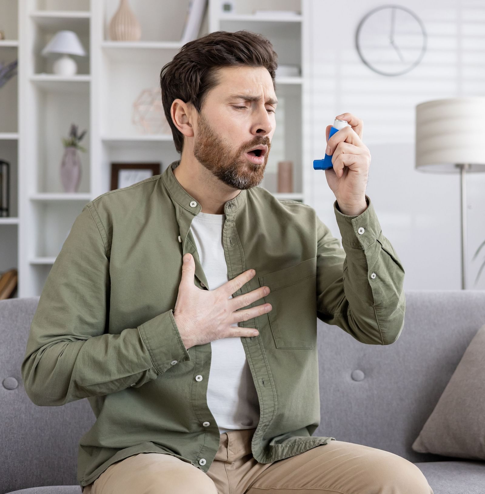 A person experiencing difficulty in breathing trying to use an inhaler - Shreyas Retreat
