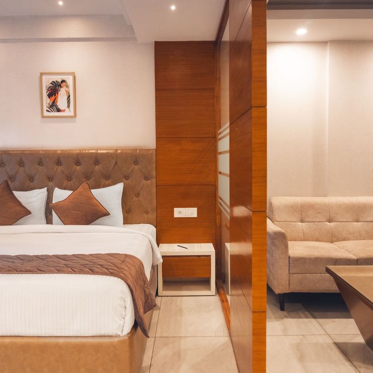 A large bed of a Super Deluxe Room at Montclair Ananta, Elite