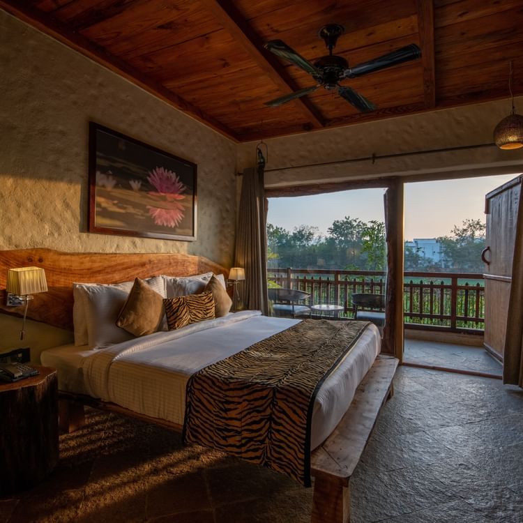 view of the bed beside the balcony offered by one of the rooms in Ranthambore