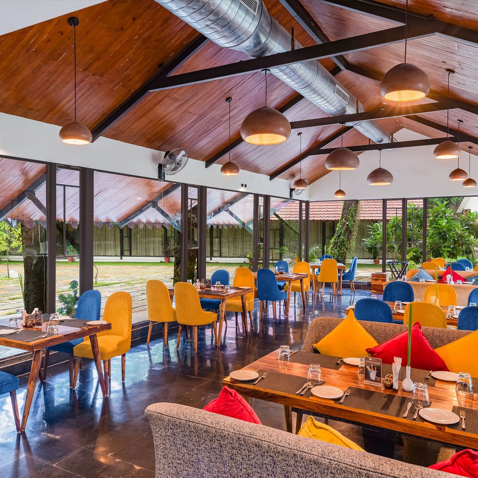image featuring the full view of Kalptaru with nicely arranged chairs and tables for a multi-cuisne dining experience at aranya vilas in udaipur 