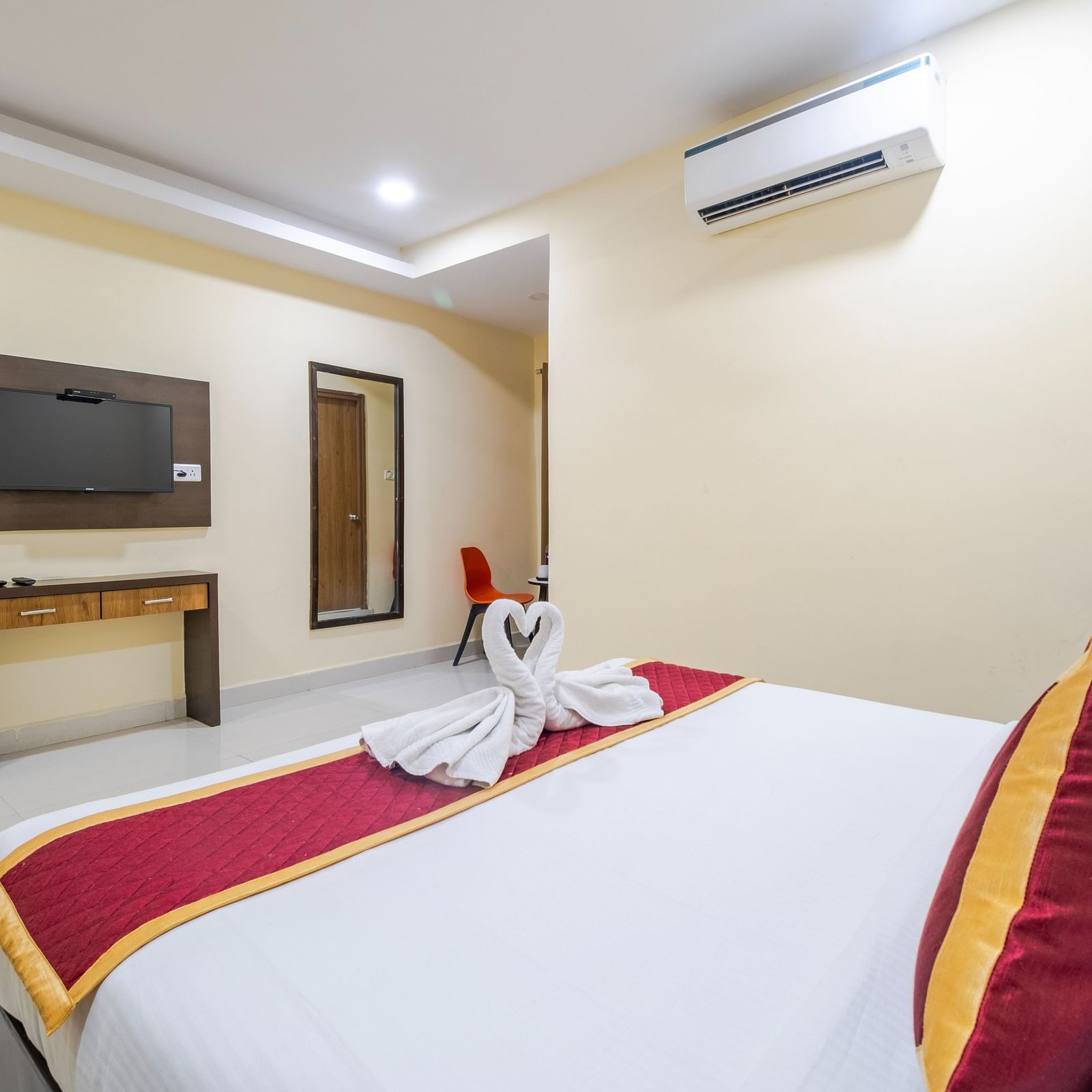 Executive room view with wall-mounted TV at Lemonridge Hotels.