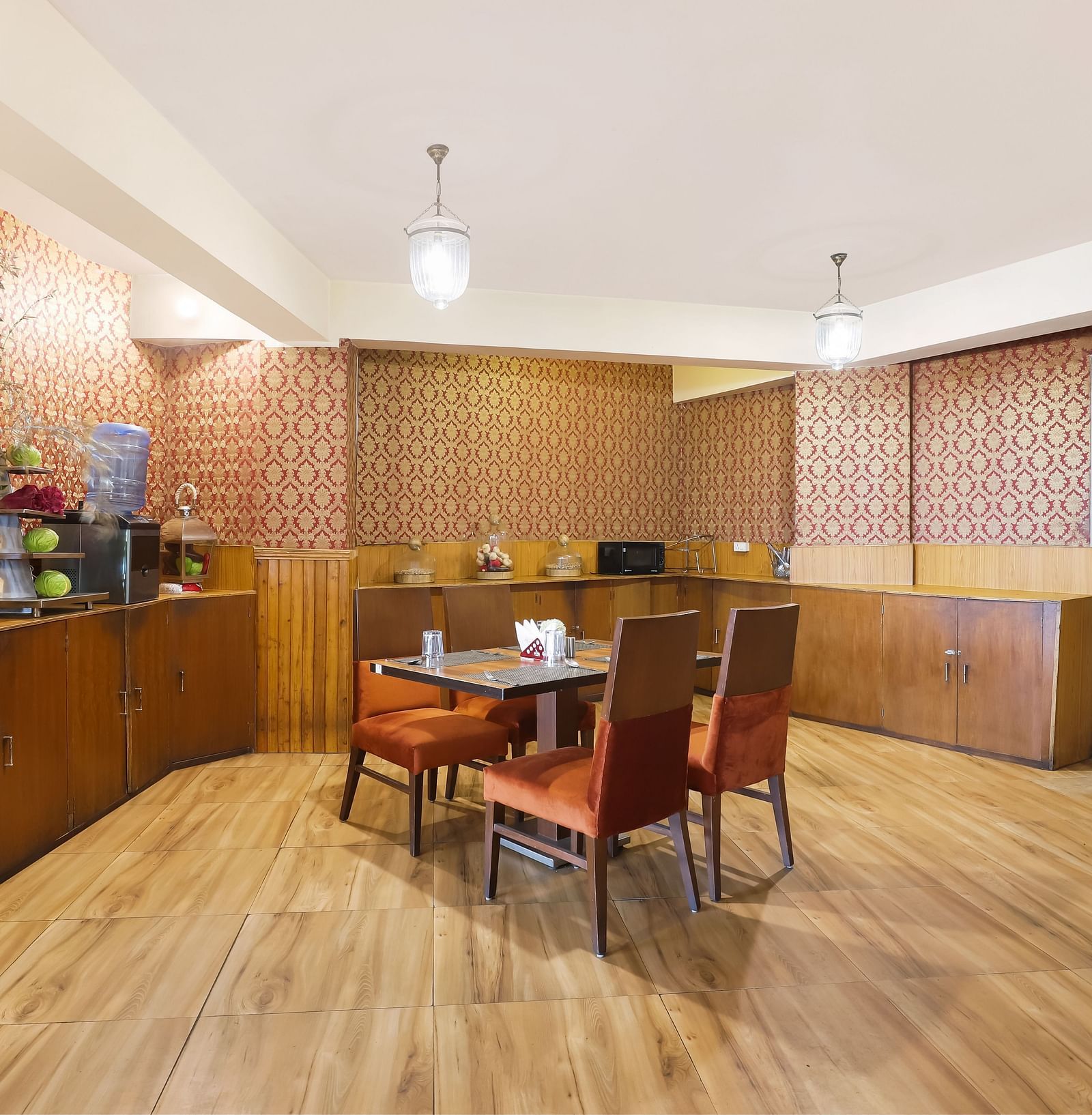 A full view of a dining area that has a dining table and four chairs | Summit Newa Regency & Spa, Pelling