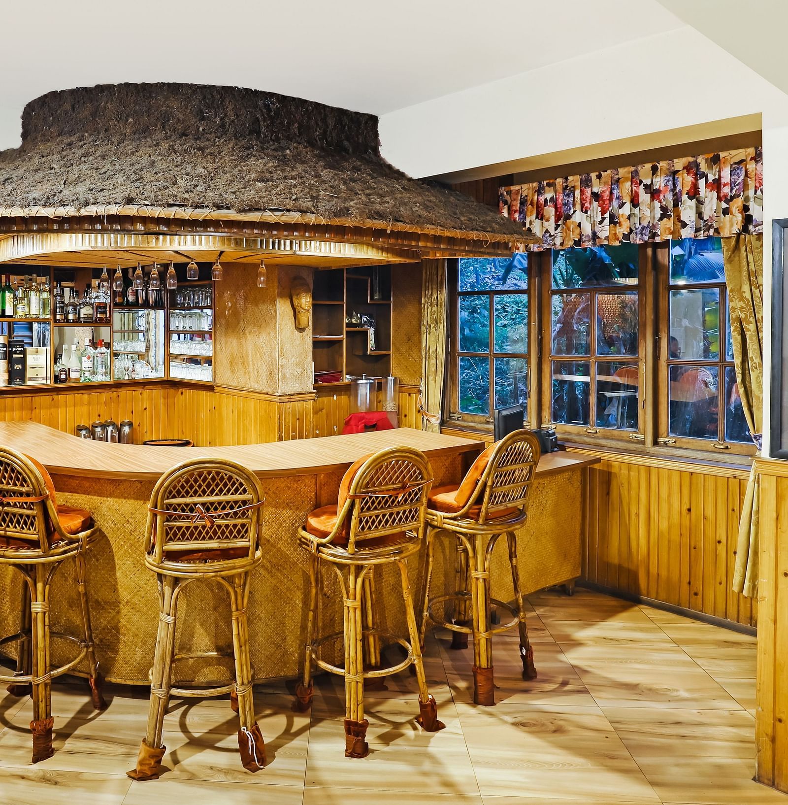 Chairs placed near a bar | Summit Newa Regency & Spa, Pelling