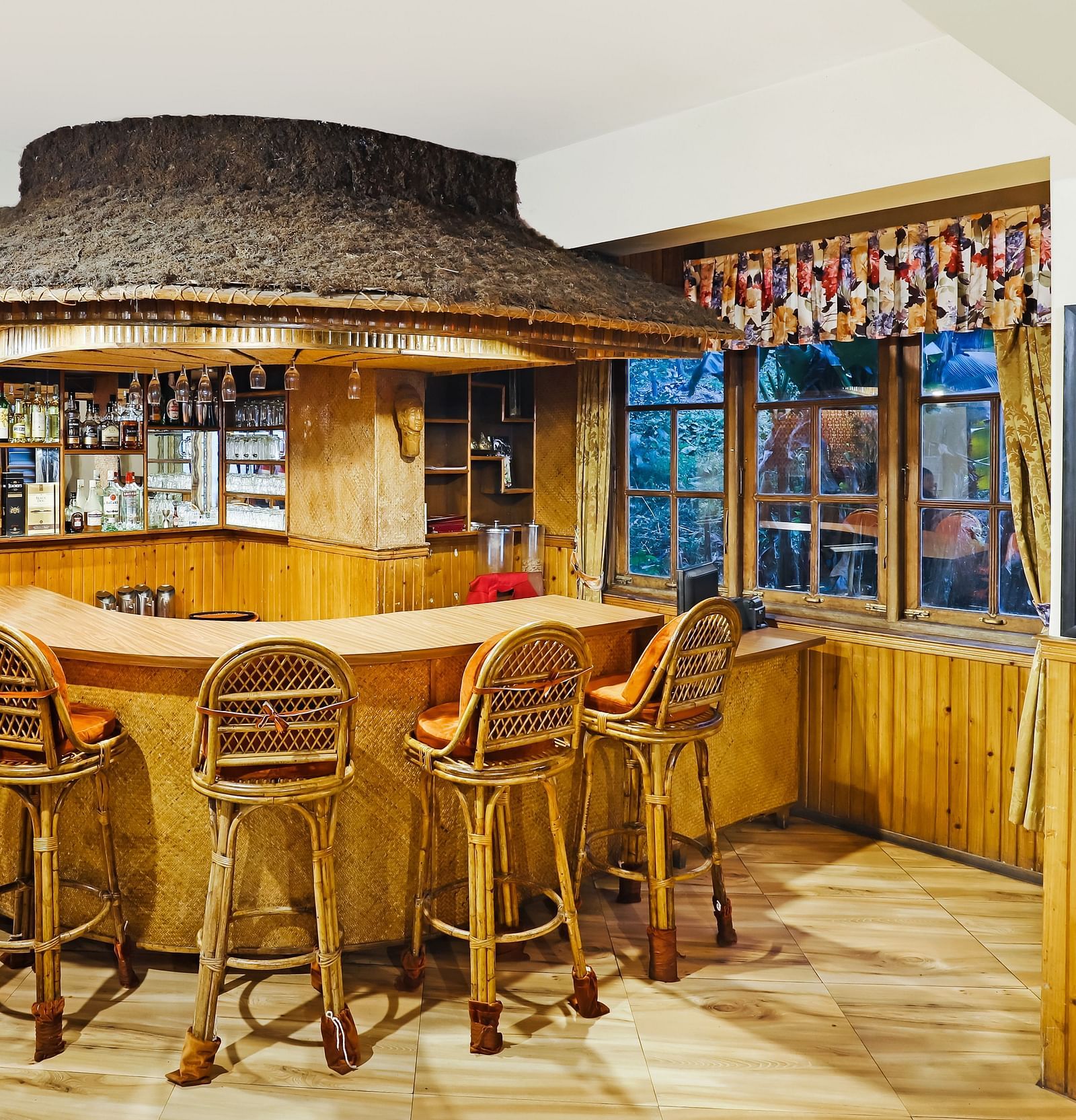 Chairs placed near a bar | Summit Newa Regency & Spa, Pelling