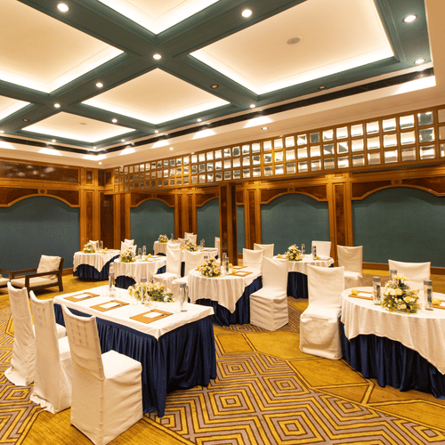 State Room - Sophisticated banquet hall with decorative ceiling, patterned carpet, and round tables for events -  Polo Floatel Kolkata