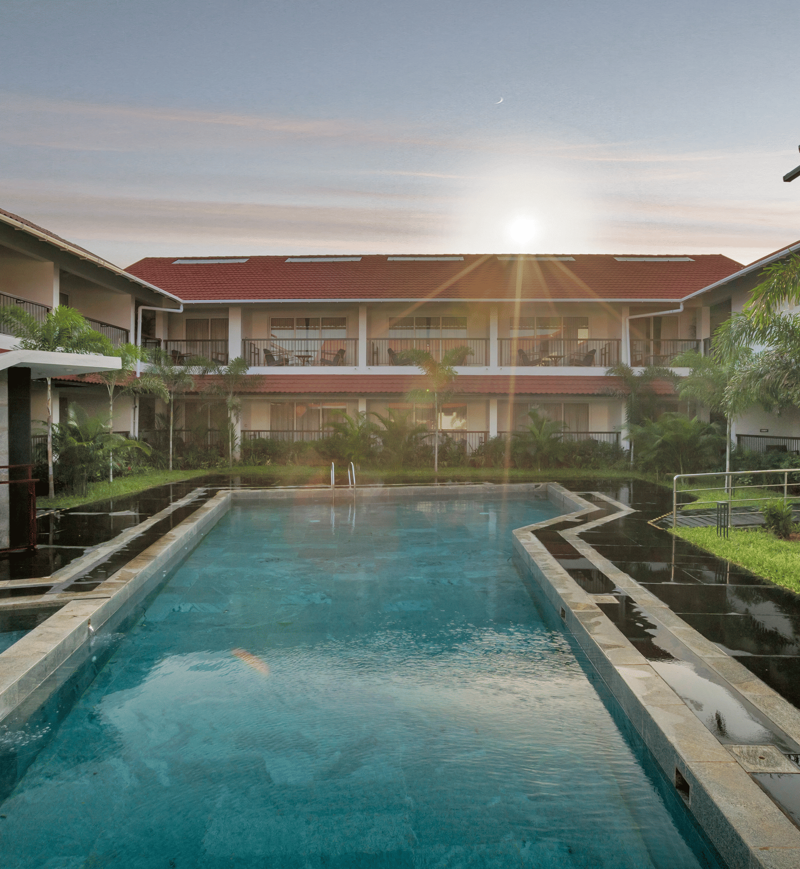 View of the swimming pool and courtyard at Mango Hill, Velankanni.