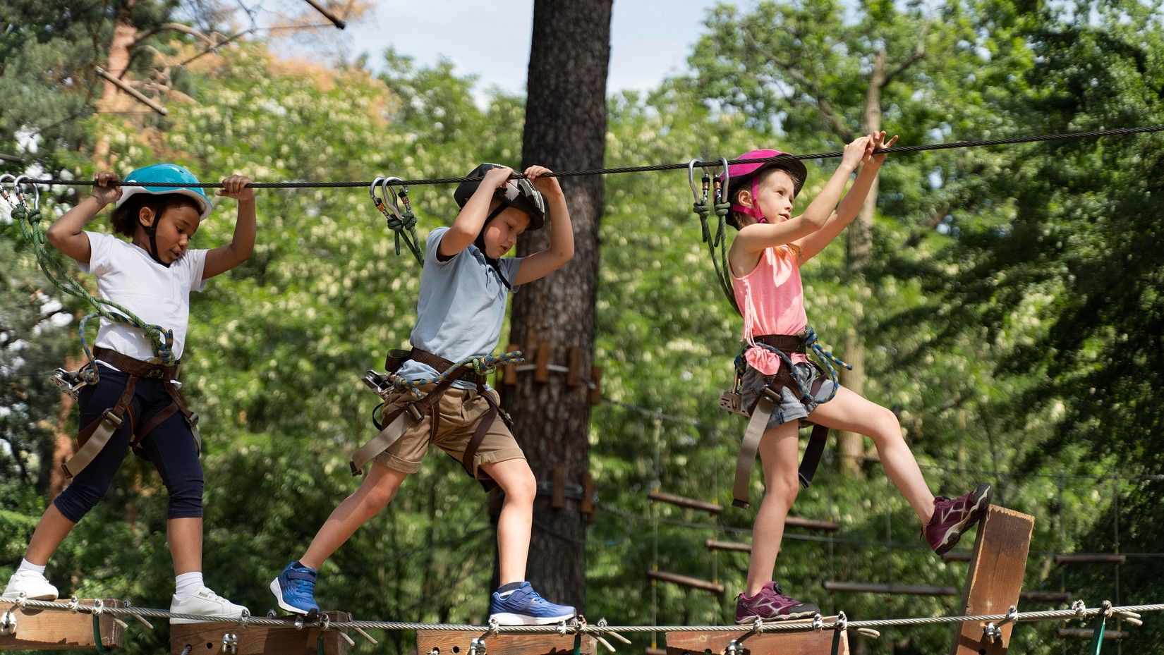 Kids walking on the zipline and having fun