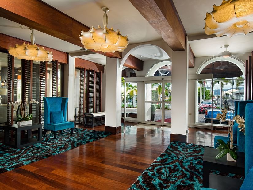 Hotel lounge with vibrant decor and turquoise seating - S Hotel Kingston, Jamaica