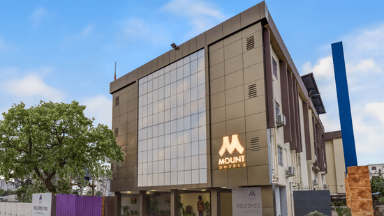 Mount Amara Hotel & Spa in Siliguri exterior featuring a modern structure with visible signage and clean architectural lines.