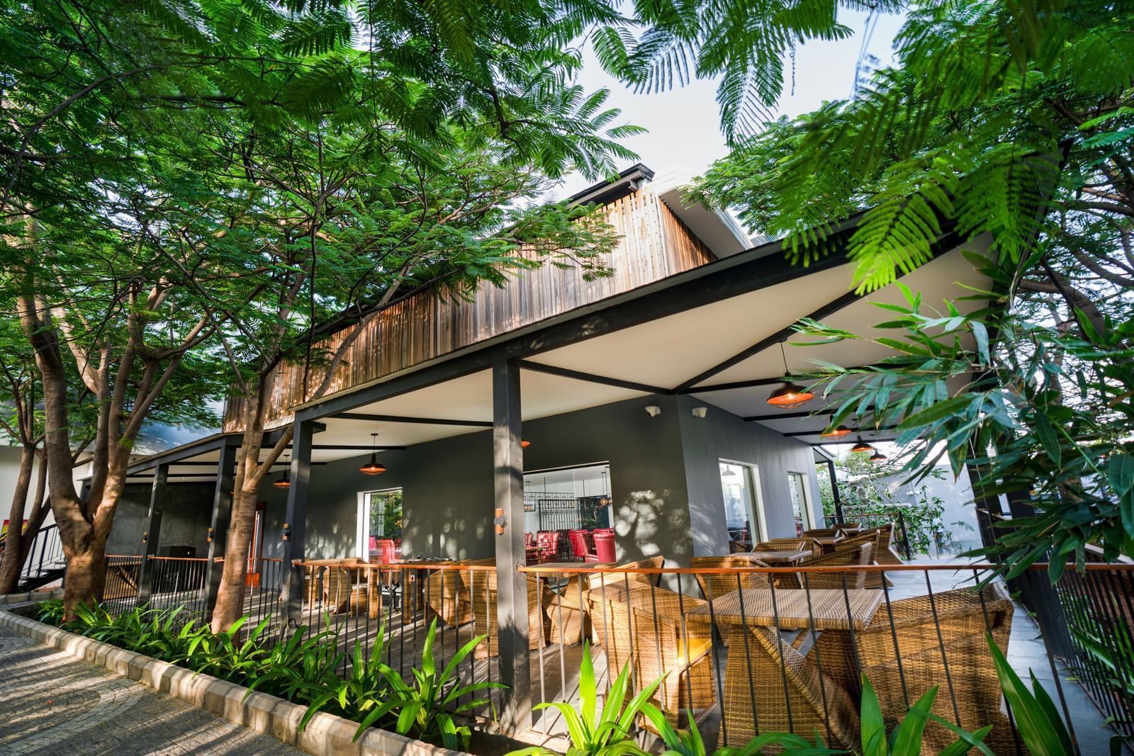 a corner view image of the Mekong surrounded by tall lush green plants - Darza Resorts