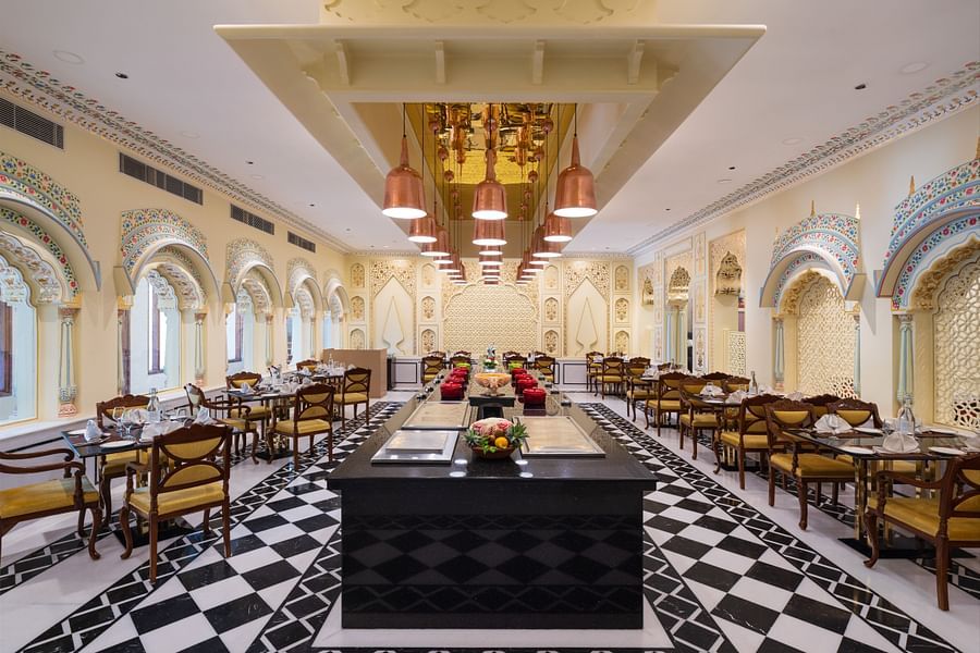 An image of the Suvarna Mahal with tables and a center piece - heritage village resorts & spa, Manesar