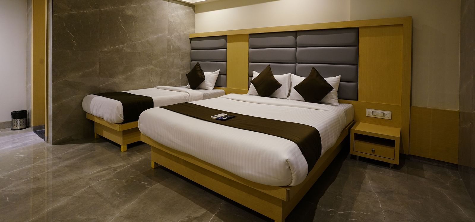 Hotel room with two single beds, dark headboards, and wardrobes - Shyanu Lords Eco Inn Airoli