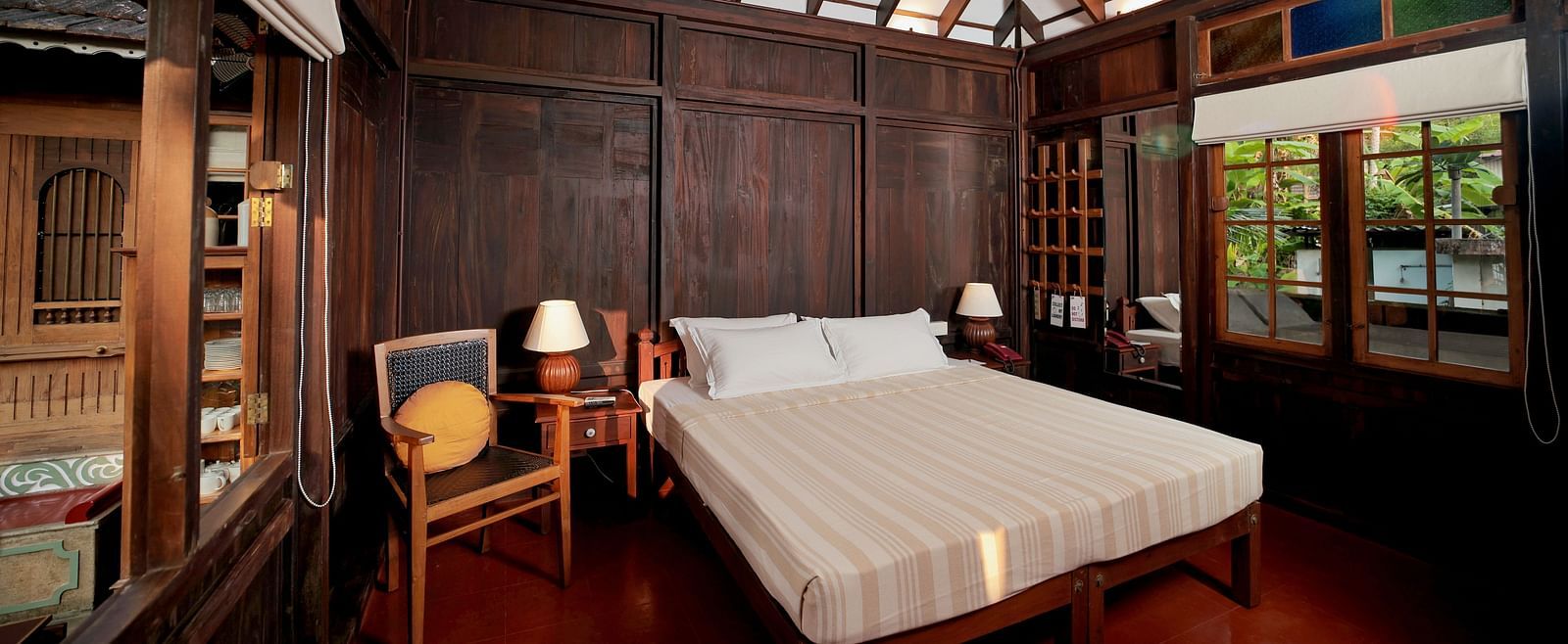 A view of a king size bed in the Heritage Cottage at Samiira on Ashtamudi Lake.