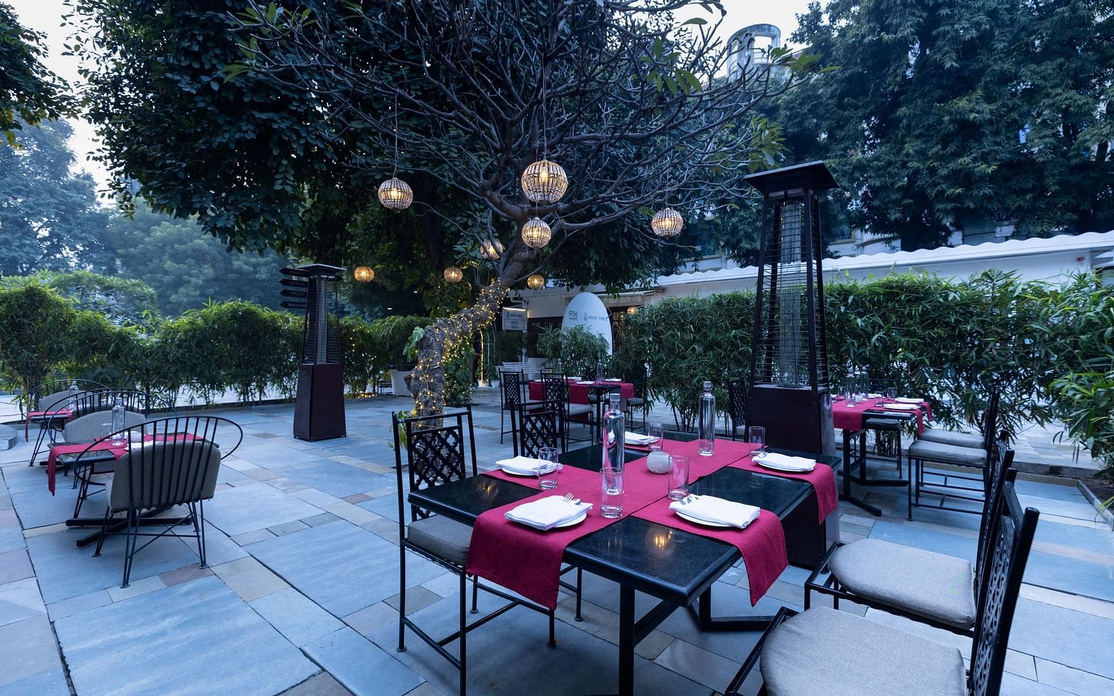 Asian Table at Saraca Hotel, Lucknow with a dining set up in the outdoor patio area