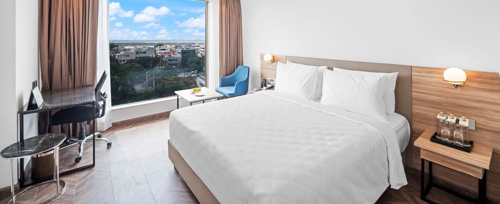 An image of a king size bed of a Grand Club Room at Grand Vijayawada by GRT Hotels.