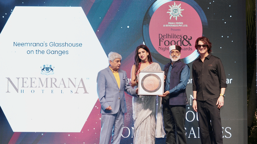 The Neemrana Hotels team receiving an award for 'Glasshouse on the Ganges' at the 2026 Delhiites Food & Nightlife Awards.