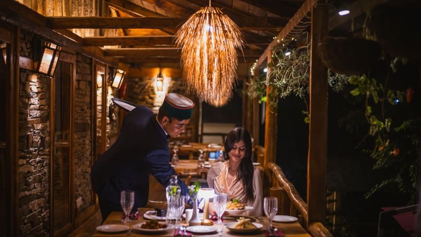 A candlelit dinner being served at the outdoor restaurant of The Manor Luxury Apartments, Shimla.