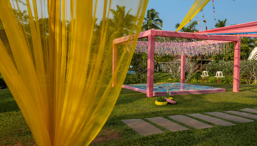   A decorated tent area with another in the background - Caravela Beach Resort Goa