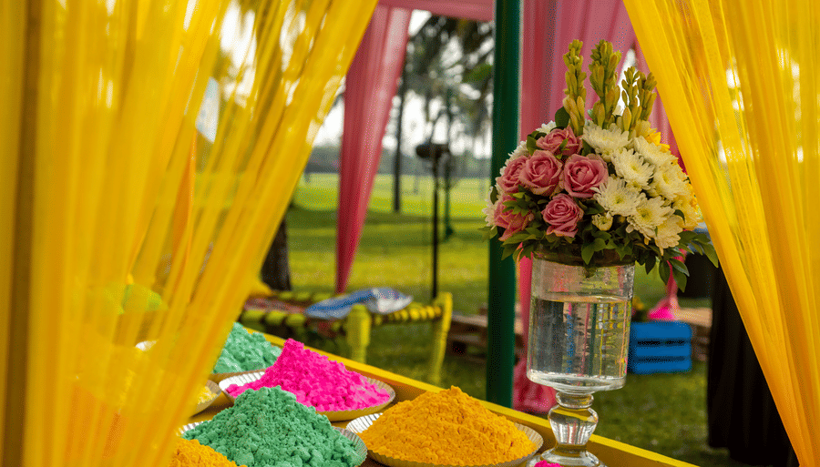 a close up shot of haldi ceremony with many powders kept on the table - Caravela Beach Resort Goa