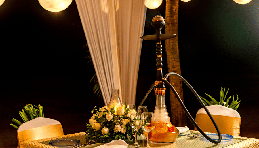 al fresco seating arrangement with a hookah pipe on it - Caravela Beach Resort Goa 