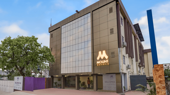 Mount Amara Hotel & Spa in Siliguri exterior featuring a modern structure with visible signage and clean architectural lines.