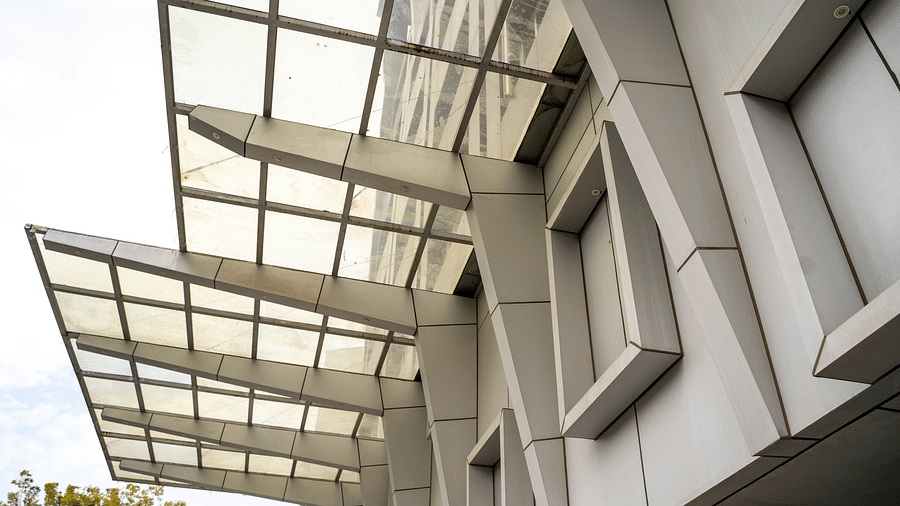 Modern architectural exterior of a building featuring sleek lines and glass panels - Hotel Udai Median, Udaipur.
